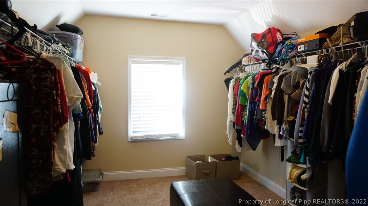 115 Shellbark Drive Spring Lake, NC 28390 - Photo 28 of 30 a view of walk in closet with clothes