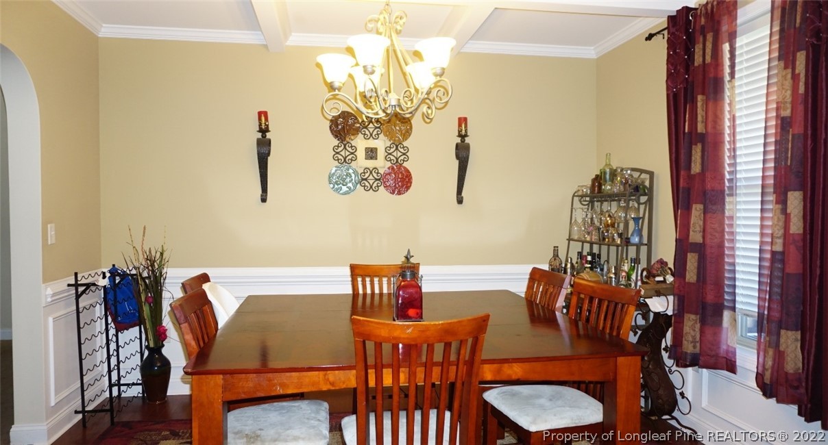 115 Shellbark Drive Spring Lake, NC 28390 - Photo 4 of 30 a view of a dining room with furniture and chandelier