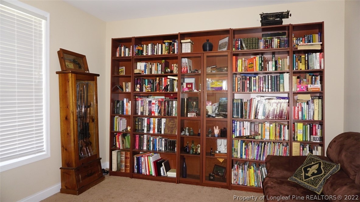115 Shellbark Drive Spring Lake, NC 28390 - Photo 5 of 30 a view of a livingroom with a bookshelf