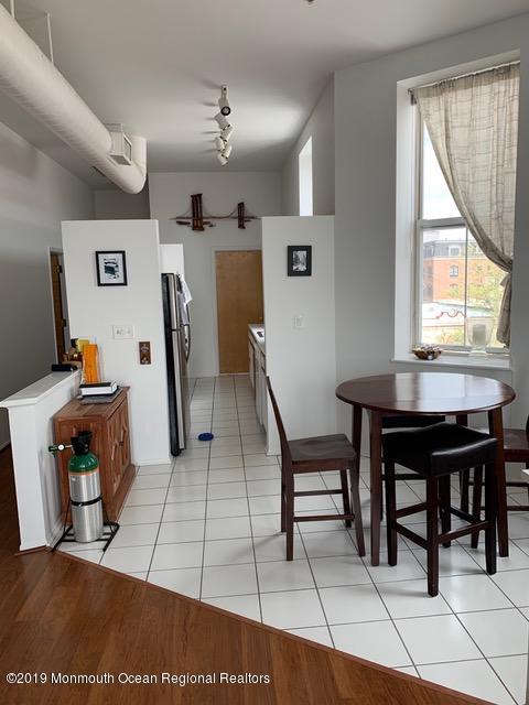 40 Broad Street, Unit 3A Red Bank, NJ 07701 - Photo 1 of 10 a workspace with furniture and window