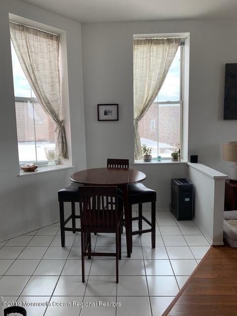40 Broad Street, Unit 3A Red Bank, NJ 07701 - Photo 2 of 10 a dining room with a window and chairs