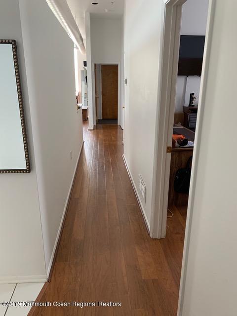 40 Broad Street, Unit 3A Red Bank, NJ 07701 - Photo 3 of 10 a view of hallway with wooden floor