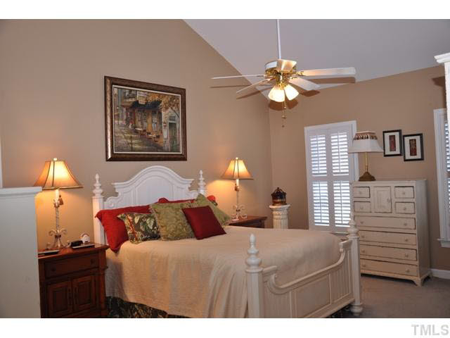 8904 Windjammer Drive Raleigh, NC 27615 - Photo 14 of 25 Welcome to the vaulted master bedroom!; wonderful plantation shutters grace the windows with privacy Master Bedroom