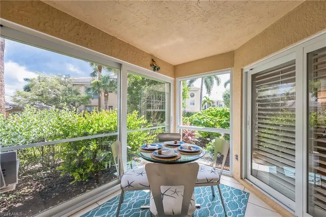 a view of a porch with furniture and outside view