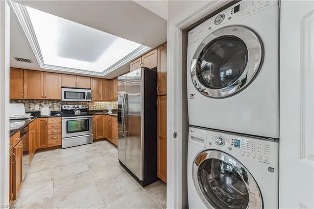 a kitchen with sink and window