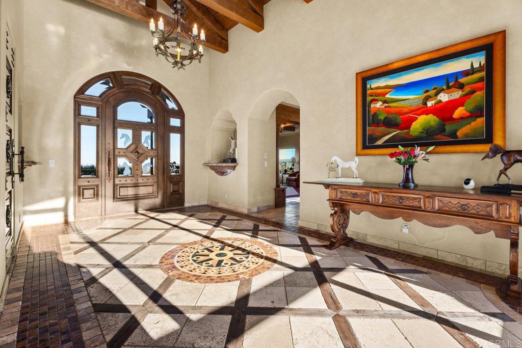 20655 Sutherland Dam Road Ramona, CA 92065 - Photo 20 of 73 a living room with furniture and a flat screen tv