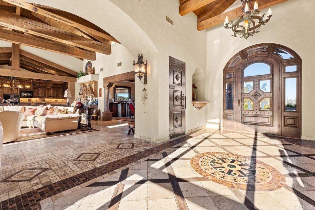 20655 Sutherland Dam Road Ramona, CA 92065 - Photo 21 of 73 a living room with furniture or chandelier and a rug