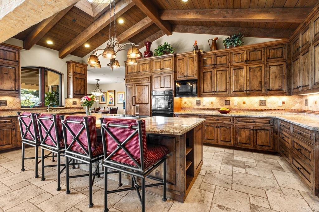 20655 Sutherland Dam Road Ramona, CA 92065 - Photo 29 of 73 a kitchen with a stove a sink and a refrigerator