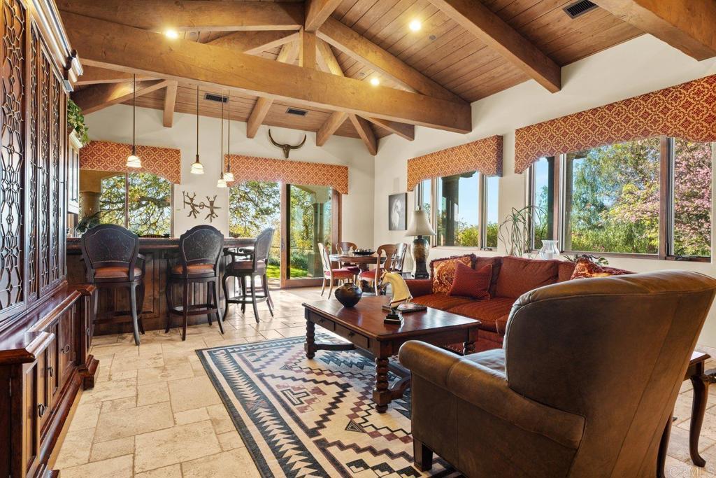 20655 Sutherland Dam Road Ramona, CA 92065 - Photo 35 of 73 a living room with furniture a fireplace and large windows
