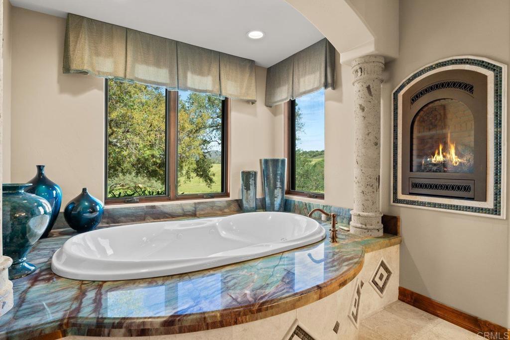 20655 Sutherland Dam Road Ramona, CA 92065 - Photo 41 of 73 a bathroom with a tub and a large window