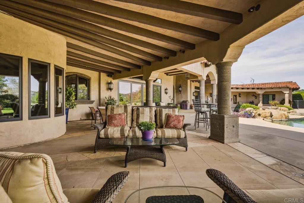 20655 Sutherland Dam Road Ramona, CA 92065 - Photo 49 of 73 a view of a patio with table and chairs
