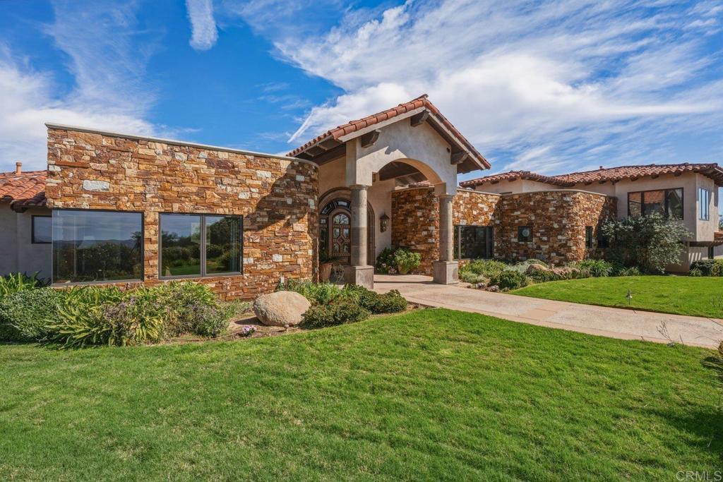 20655 Sutherland Dam Road Ramona, CA 92065 - Photo 7 of 73 a front view of a house with garden