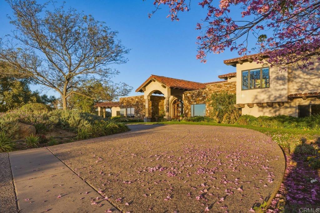 20655 Sutherland Dam Road Ramona, CA 92065 - Photo 10 of 73 a front view of a house with a yard and garage