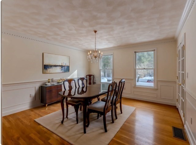29 Stoneybrook Circle Andover, MA 01810 - Photo 22 of 41 a view of a dining room with furniture window and wooden floor