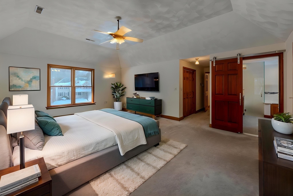 29 Stoneybrook Circle Andover, MA 01810 - Photo 25 of 41 a bedroom with a bed and a chandelier