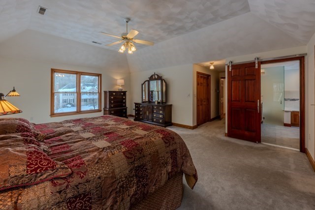 29 Stoneybrook Circle Andover, MA 01810 - Photo 26 of 41 a spacious bedroom with a bed and a large mirror on dresser