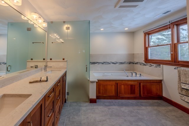29 Stoneybrook Circle Andover, MA 01810 - Photo 28 of 41 a bathroom with a sink double vanity and a mirror