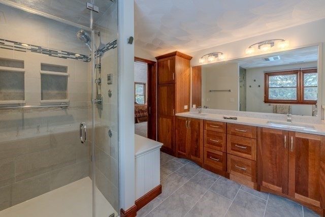 29 Stoneybrook Circle Andover, MA 01810 - Photo 29 of 41 a spacious bathroom with a double vanity sink mirror and shower