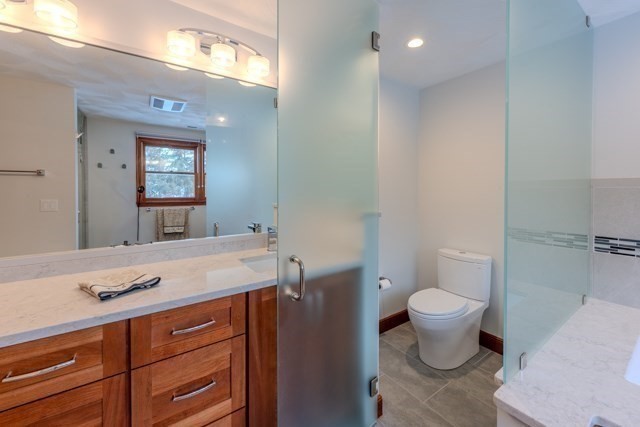 29 Stoneybrook Circle Andover, MA 01810 - Photo 31 of 41 a bathroom with a sink toilet a mirror and vanity