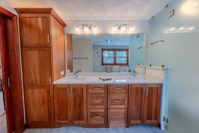 29 Stoneybrook Circle Andover, MA 01810 - Photo 32 of 41 a bathroom with a granite countertop sink and a mirror