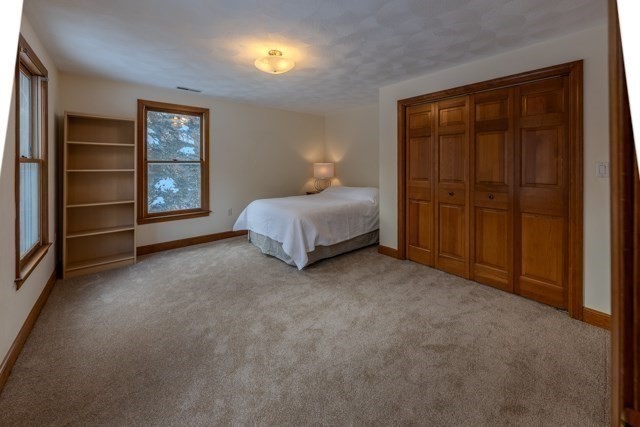 29 Stoneybrook Circle Andover, MA 01810 - Photo 33 of 41 a spacious bedroom with a bed and a window