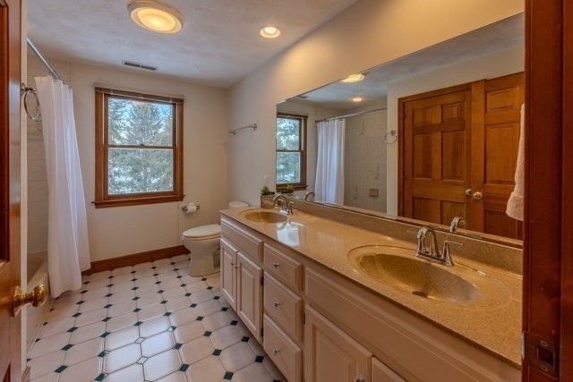 29 Stoneybrook Circle Andover, MA 01810 - Photo 35 of 41 a bathroom with a double vanity sink mirror and toilet
