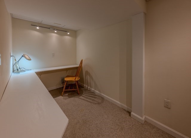 29 Stoneybrook Circle Andover, MA 01810 - Photo 38 of 41 a room with a chair and a table