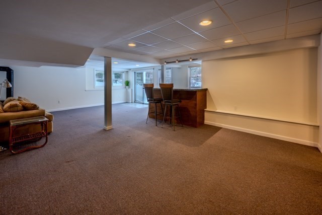29 Stoneybrook Circle Andover, MA 01810 - Photo 40 of 41 a view of a room with furniture and a garage