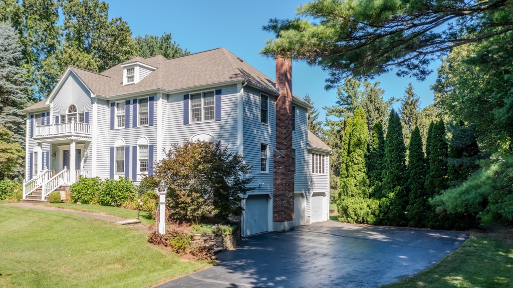 29 Stoneybrook Circle Andover, MA 01810 - Photo 4 of 41 a front view of a house with garden