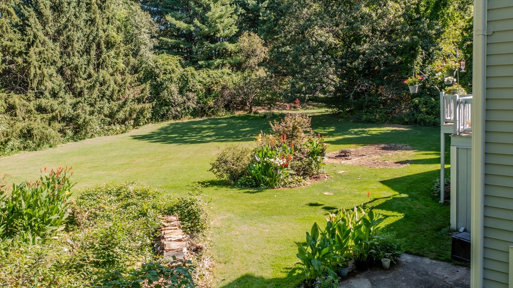 29 Stoneybrook Circle Andover, MA 01810 - Photo 5 of 41 a view of a lake with a tree