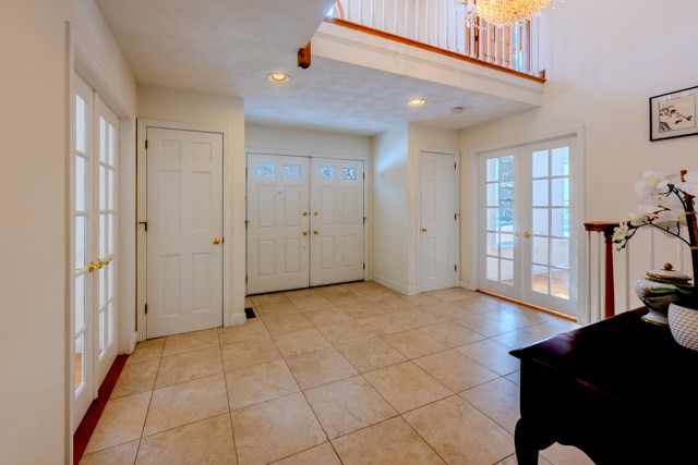 29 Stoneybrook Circle Andover, MA 01810 - Photo 6 of 41 a view of a livingroom with an empty space and a window