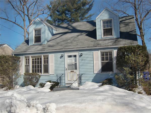 207 Shawmut Street Springfield, MA 01108 - Photo 1 of 1 a view of a house with a yard covered in snow
