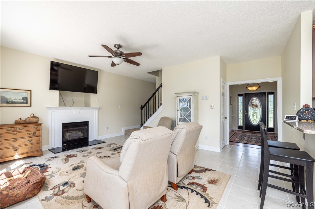16211 River Road Chesterfield, VA 23838 - Photo 17 of 40 a living room with furniture a fireplace and a flat screen tv