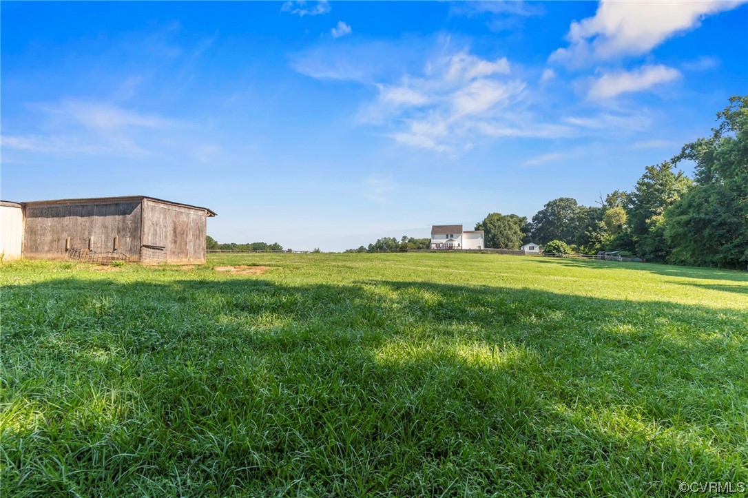 16211 River Road Chesterfield, VA 23838 - Photo 33 of 40 a view of a garden with a building in the background