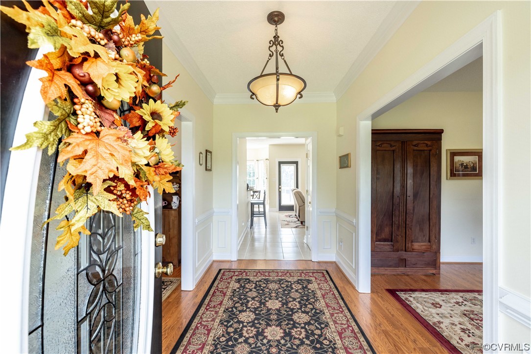 16211 River Road Chesterfield, VA 23838 - Photo 5 of 40 a view of a hallway with wooden floor and a potted plant