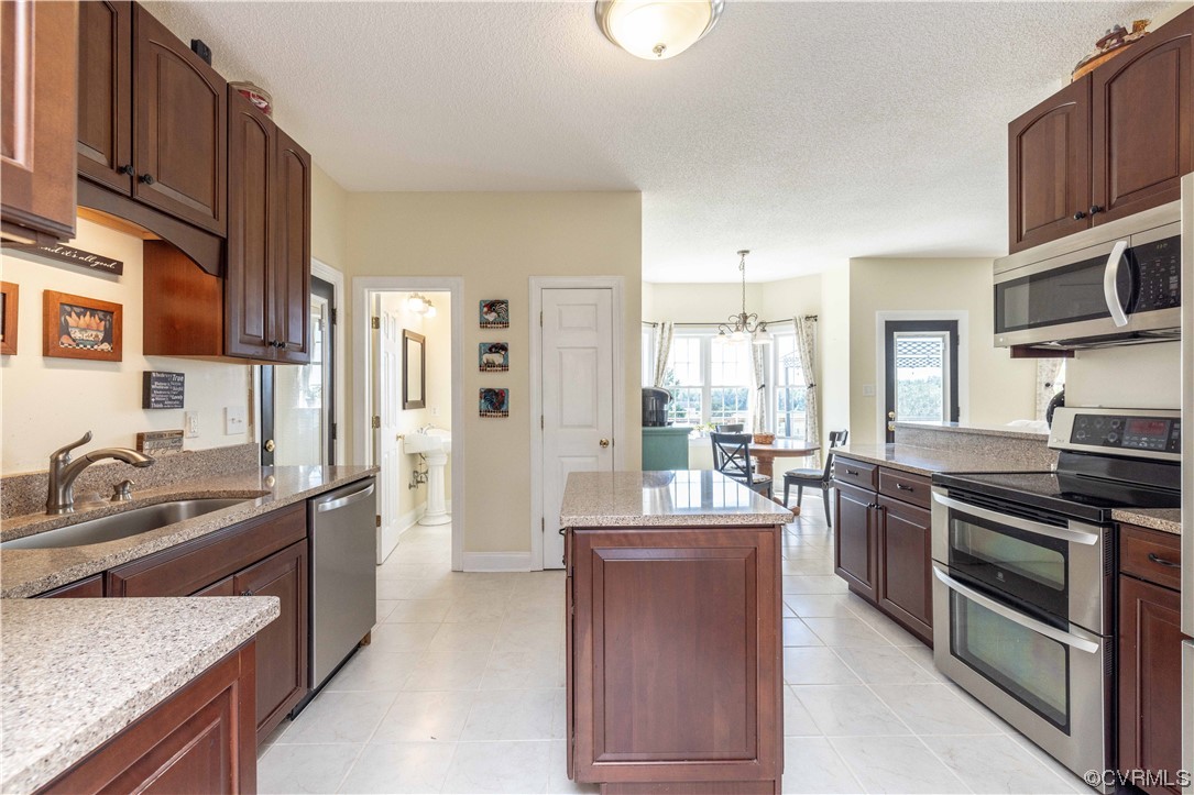 16211 River Road Chesterfield, VA 23838 - Photo 7 of 40 a large kitchen with stainless steel appliances granite countertop a stove and a sink