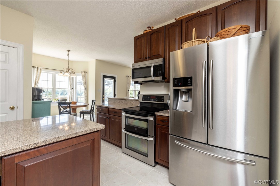 16211 River Road Chesterfield, VA 23838 - Photo 8 of 40 a kitchen with stainless steel appliances a refrigerator stove microwave and sink