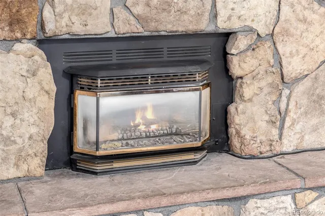 a kitchen with white cabinets stainless steel appliances and a sink