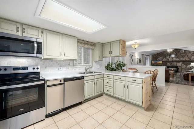 a dining room with a table and chairs
