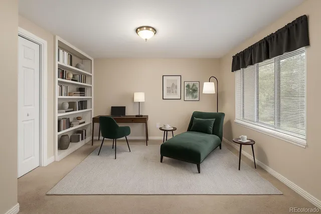 a bedroom with furniture and a flat screen tv