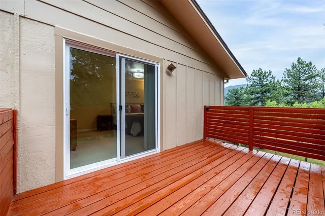 a bedroom with bed couch and window