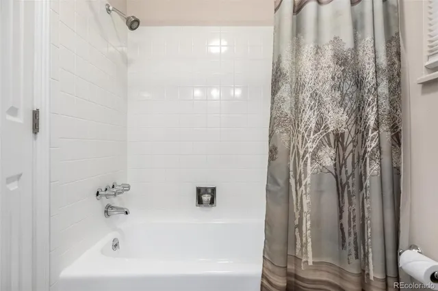 a view of a lush green hillside and a mountain