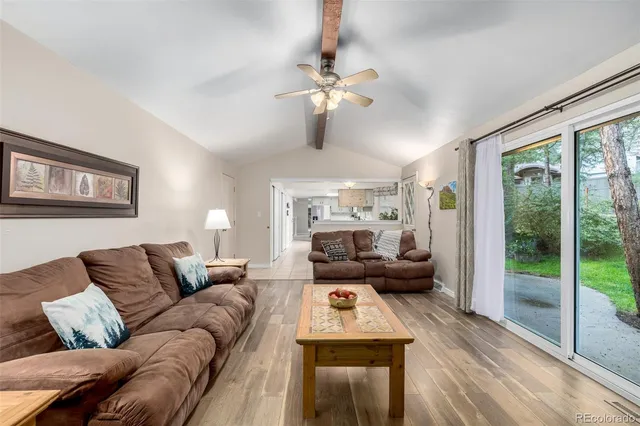 a view of a dining room with furniture and a chandelier