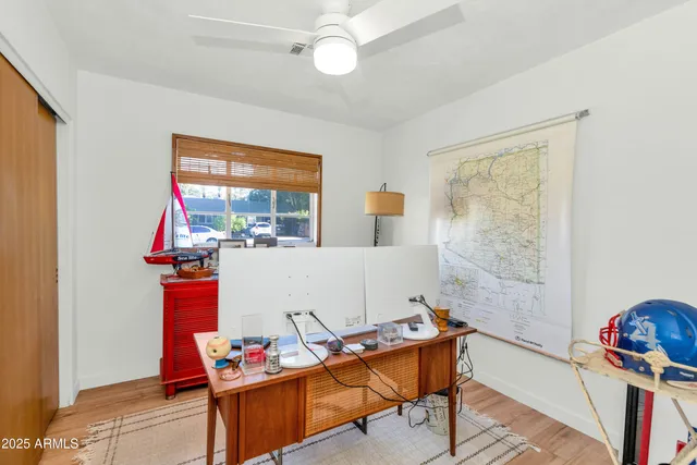 a workspace with furniture and window