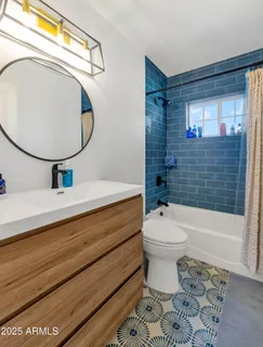 a bathroom with a toilet a sink and bathtub