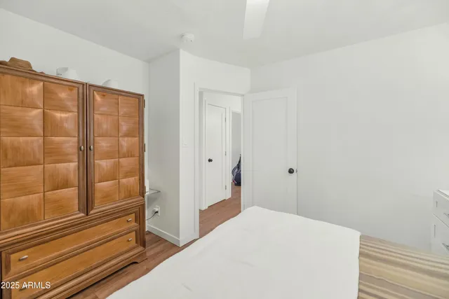 a bedroom with a bed and a shower