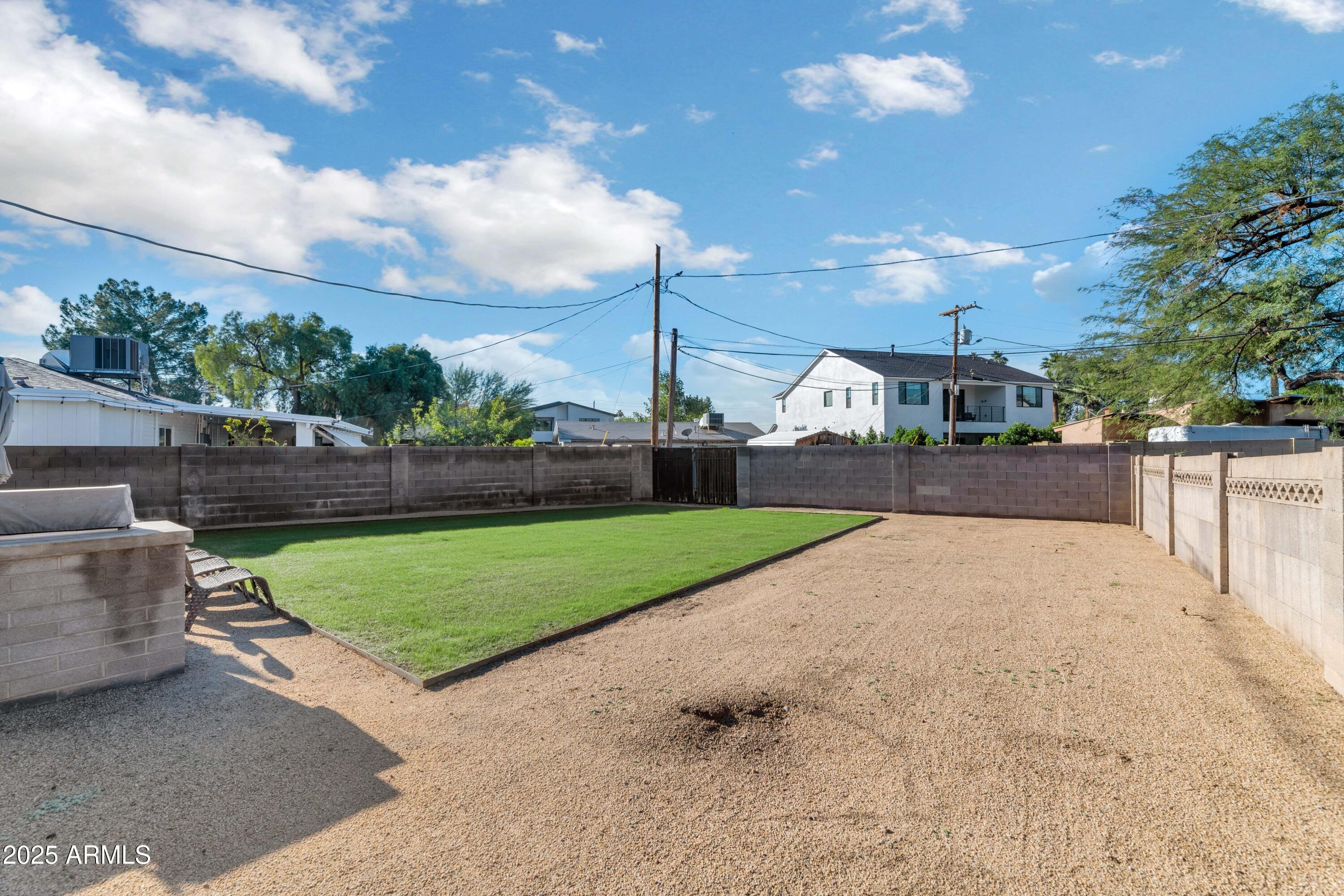 4549 East Campbell Avenue Phoenix, AZ 85018 - Photo 17 of 19 a view of a street with a big yard