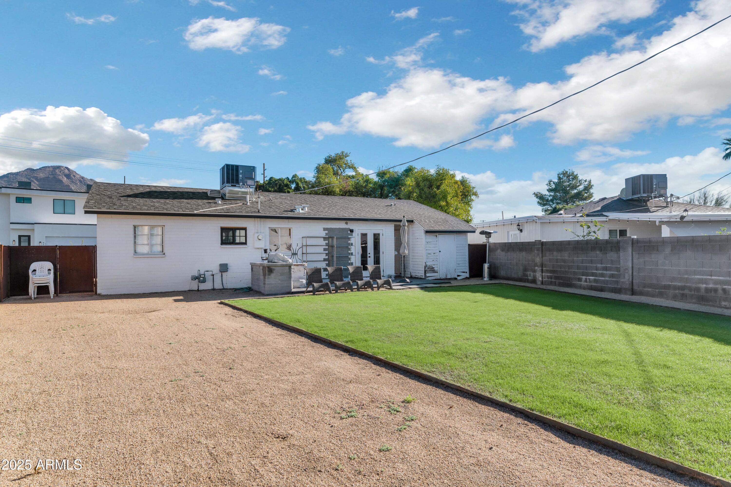 4549 East Campbell Avenue Phoenix, AZ 85018 - Photo 19 of 19 a front view of a house with garden