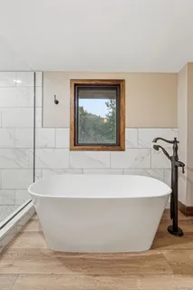 a white bath tub sitting in a bathroom