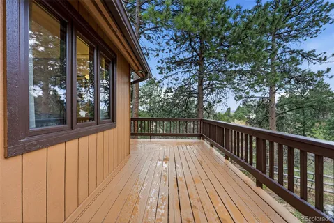 a view of balcony with wooden floor